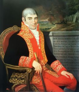 El teniente, Félix Ma. Calleja del Rey, gobernó de 1813 a1816. Aparece sentado y lleva en la mano otro de los símbolos de poder que se vieron en el Palacio. El bastón de mando.